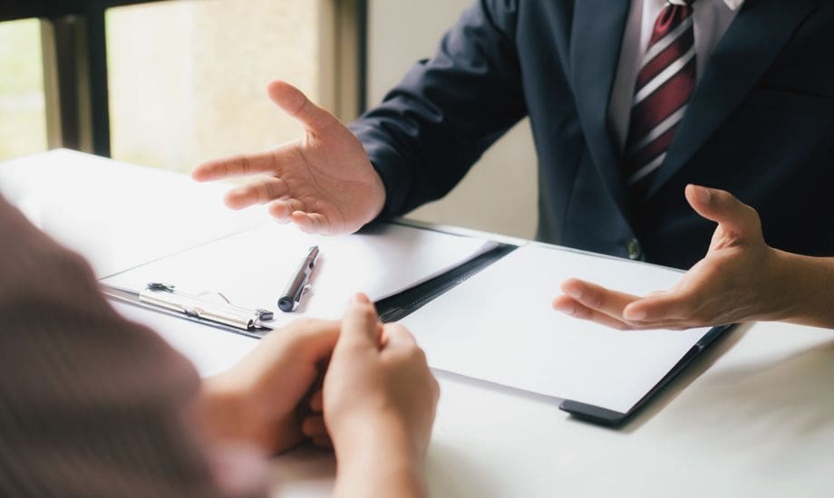 debt recovery - business owners discuss paper work