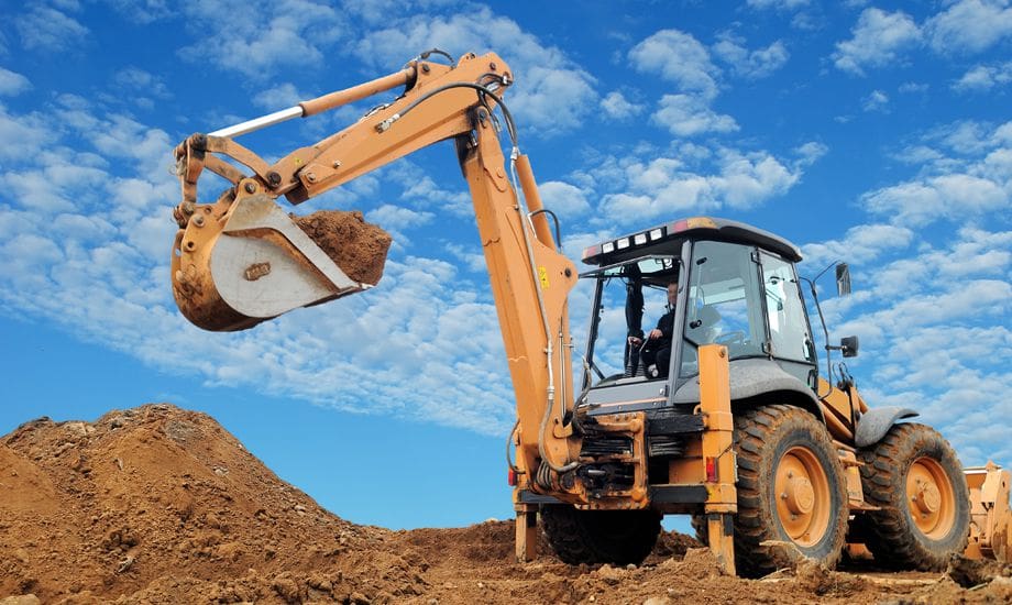 construction industry finance - construction vehicle working on a building site