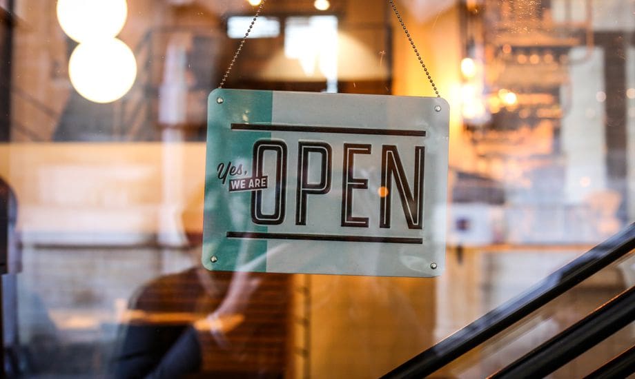 reatil industry finance - retail shop with open for business sign displayed