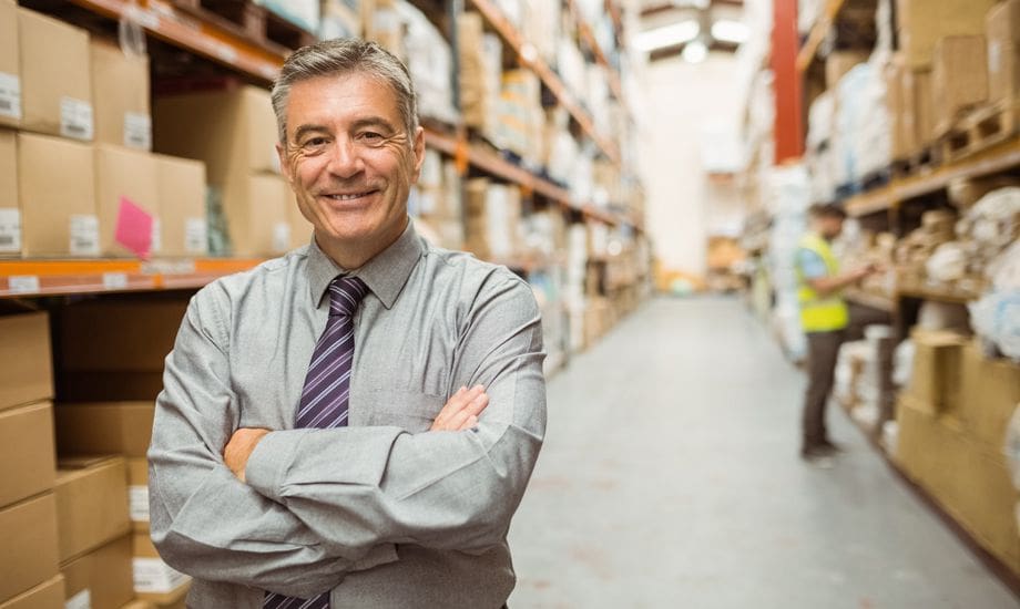 secured vs unsecured business loans- business owner in a warehouse